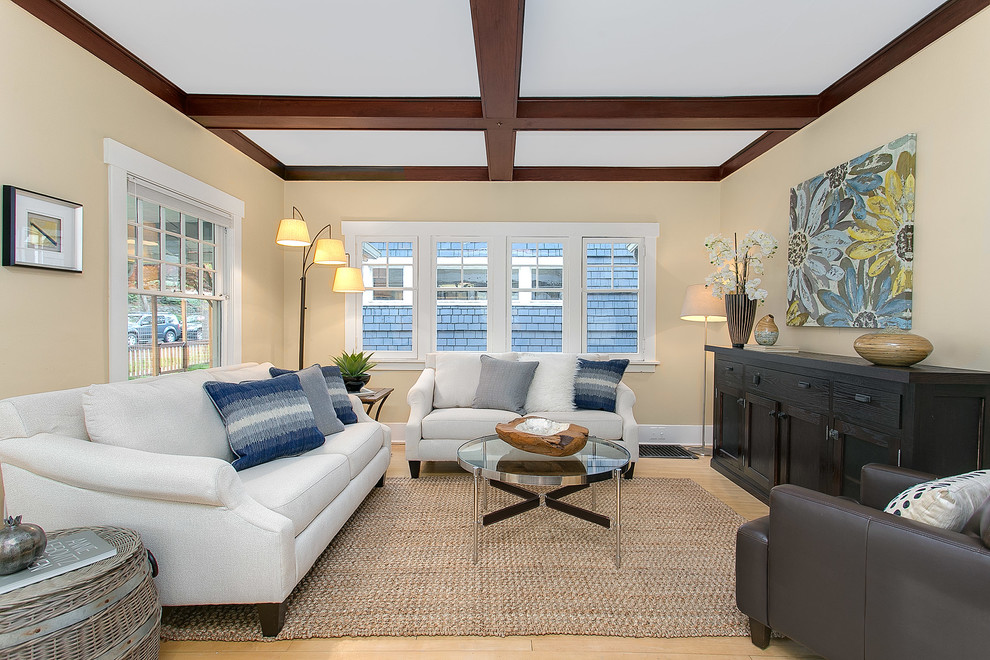 Photo of a large transitional formal open concept living room in Seattle with beige walls and light hardwood floors.