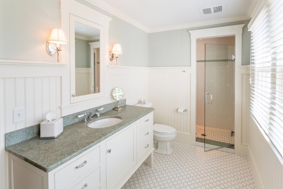 Design ideas for a large transitional master bathroom in Boston with flat-panel cabinets, white cabinets, a freestanding tub, an alcove shower, a two-piece toilet, white tile, ceramic tile, blue walls, ceramic floors, an undermount sink and solid surface benchtops.