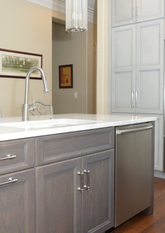 Mid-sized transitional l-shaped medium tone wood floor eat-in kitchen photo in Chicago with recessed-panel cabinets, gray cabinets, multicolored backsplash, an island, an undermount sink, quartzite countertops, mosaic tile backsplash and stainless steel appliances