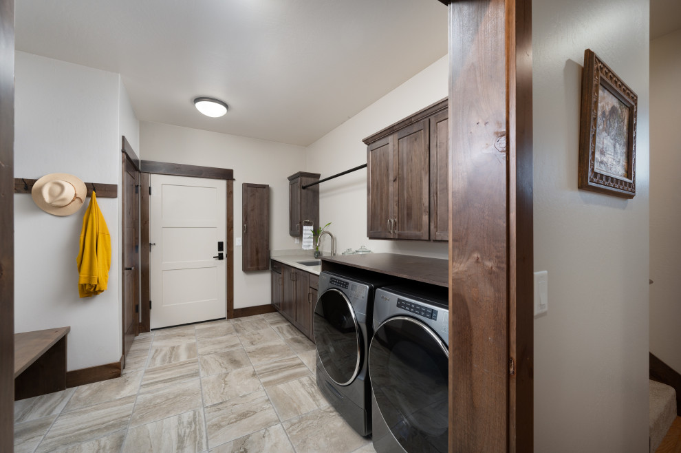 Design ideas for a galley laundry room in Other with an utility sink, shaker cabinets, quartz benchtops, ceramic floors and a side-by-side washer and dryer.