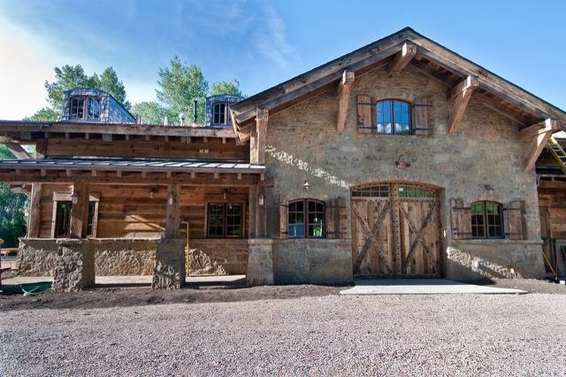 Large mountain style home design photo in Denver