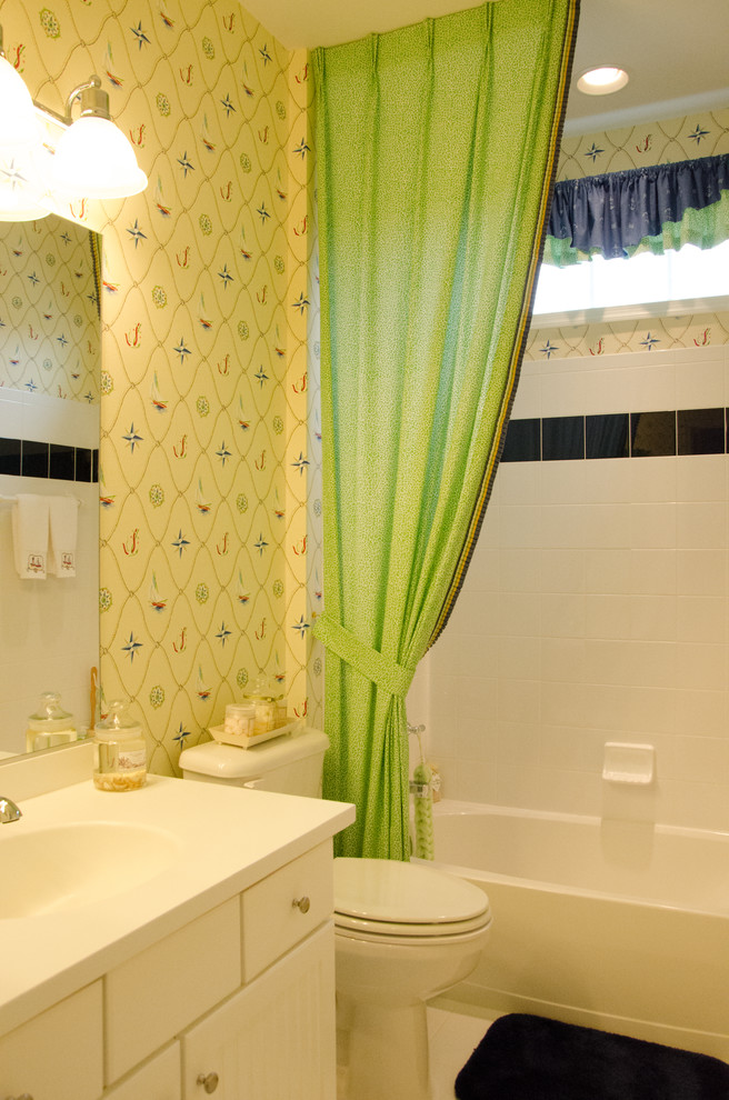 Beach style tub/shower combo photo with white cabinets and white walls