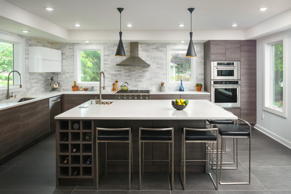 Inspiration for a contemporary u-shaped separate kitchen in Seattle with flat-panel cabinets, grey cabinets, with island, grey floor, an undermount sink, grey splashback and stainless steel appliances.