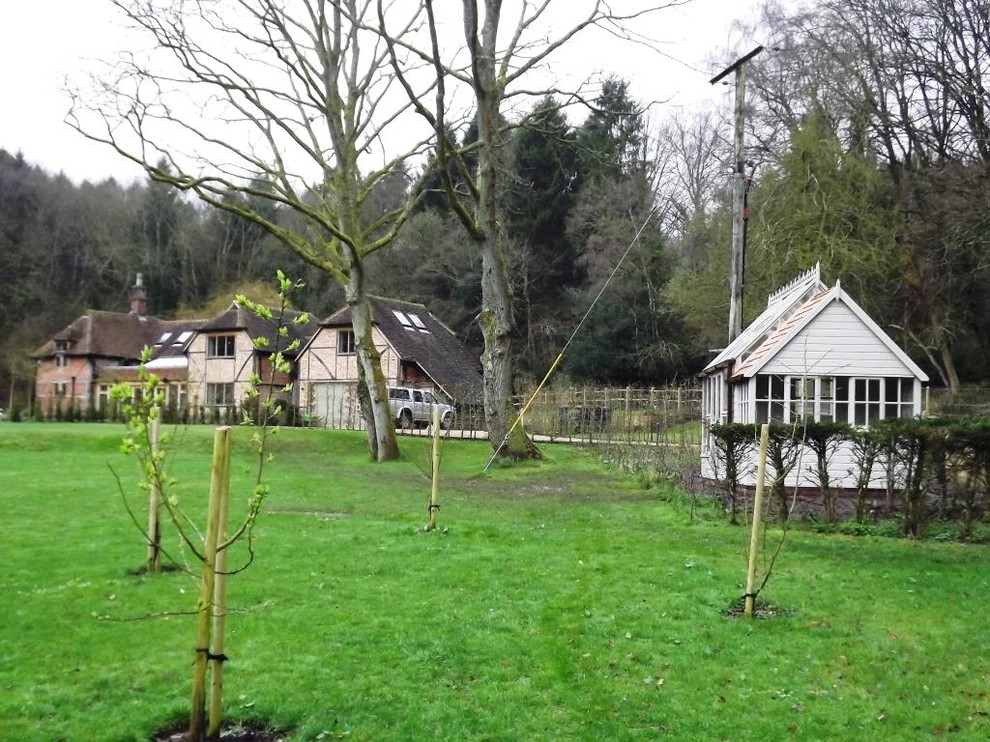 This is an example of a large traditional detached greenhouse in Surrey.