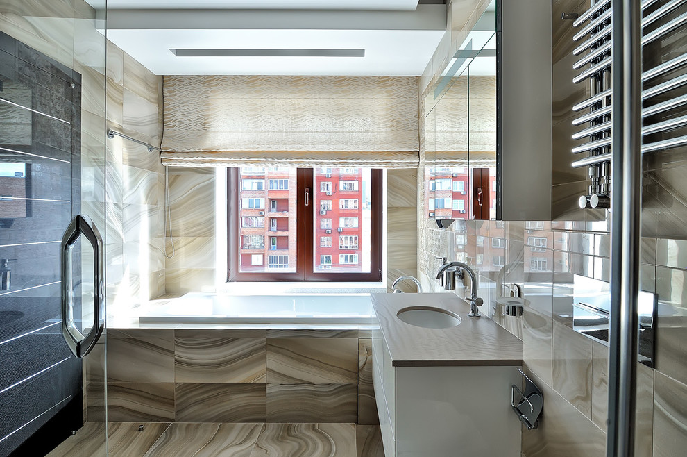 Inspiration for a contemporary bathroom in Moscow with beige tile, an undermount sink and an alcove tub.