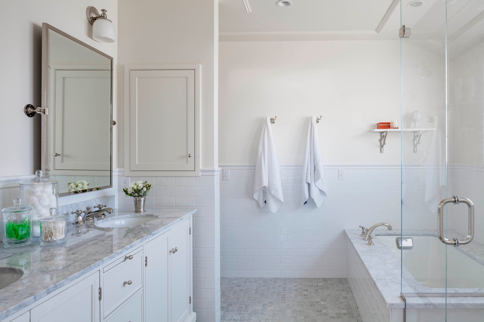 Inspiration for a large beach style master bathroom in Providence with an undermount sink, beaded inset cabinets, white cabinets, marble benchtops, an undermount tub, a curbless shower, white walls and mosaic tile floors.