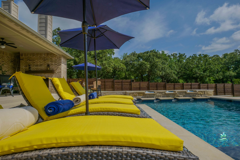 Pool landscaping - huge mediterranean backyard custom-shaped infinity pool landscaping idea in Dallas with decking