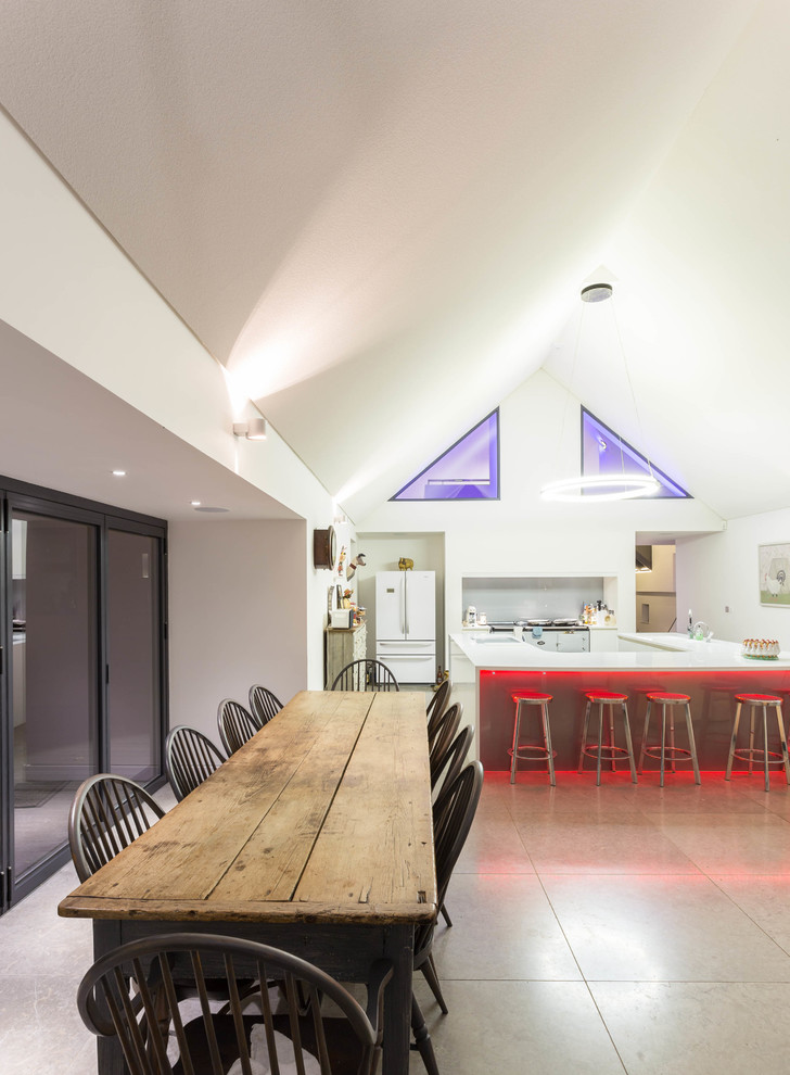 Contemporary dining room in Cambridgeshire with white walls and no fireplace.