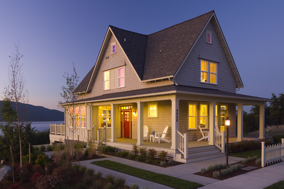 Mid-sized traditional two-storey exterior in Providence with wood siding.