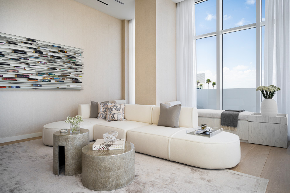 Photo of an expansive contemporary living room in Miami with light hardwood flooring.