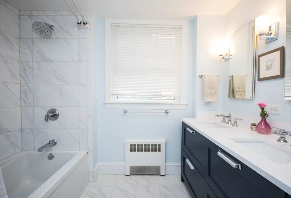 This is an example of a mid-sized modern master bathroom in Providence with beaded inset cabinets, blue cabinets, a drop-in tub, an open shower, a one-piece toilet, white tile, ceramic tile, blue walls, ceramic floors, an undermount sink, tile benchtops, white floor and a shower curtain.