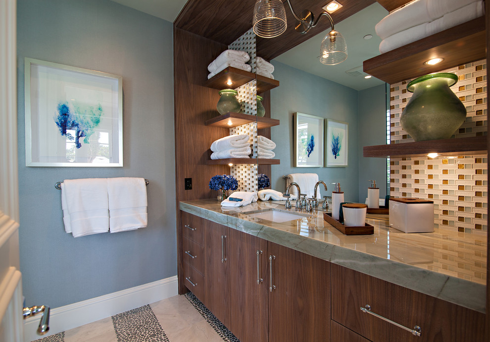 Photo of an expansive transitional bathroom in Miami with flat-panel cabinets, medium wood cabinets, green tile, mosaic tile, blue walls, pebble tile floors, an undermount sink and marble benchtops.