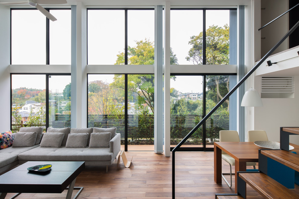 Inspiration for a modern open concept living room in Tokyo Suburbs with white walls and medium hardwood floors.