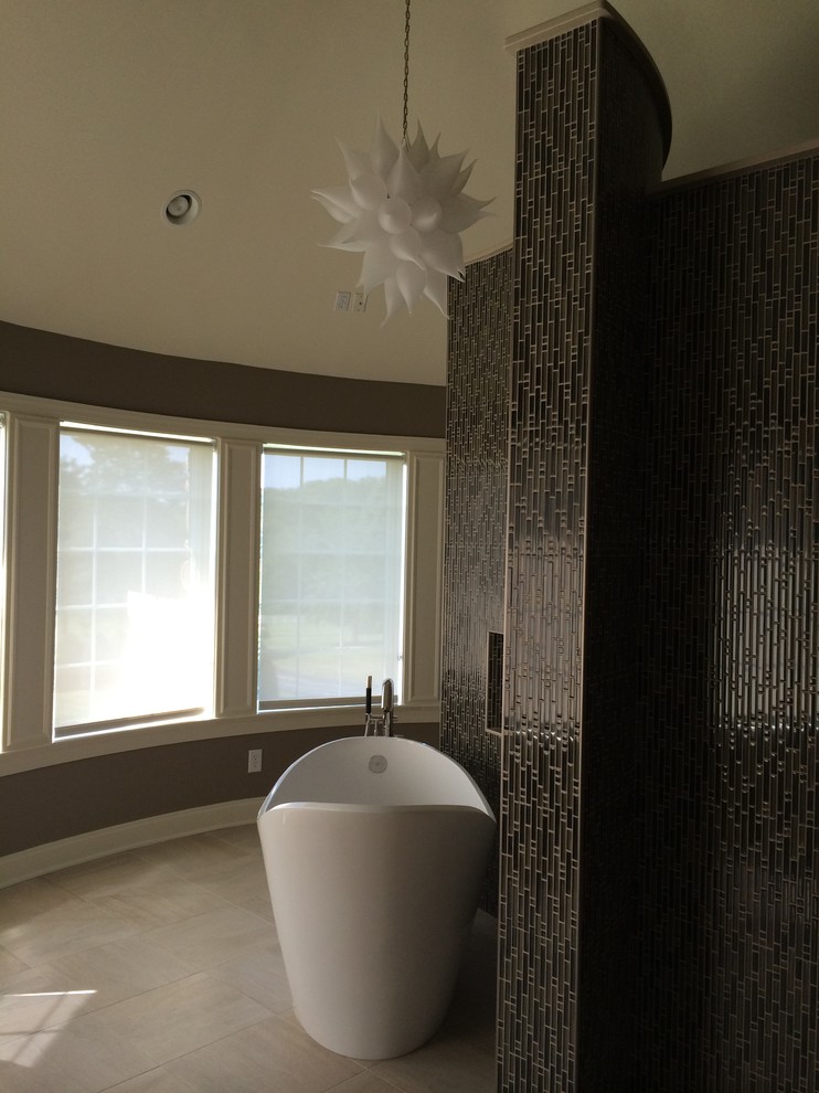 Freestanding bathtub - large transitional master limestone floor and white floor freestanding bathtub idea with beige walls