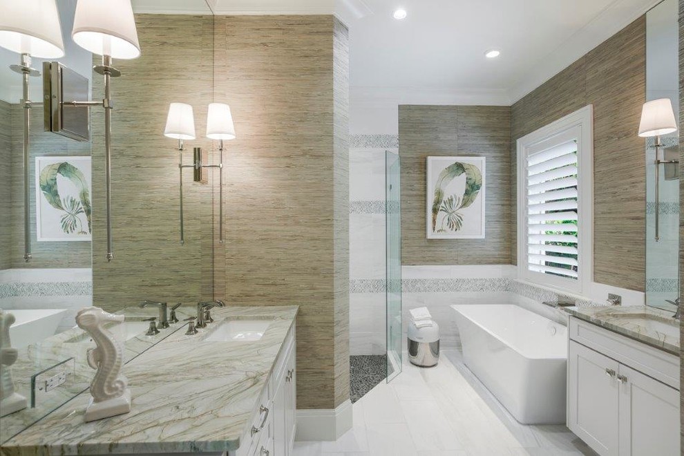 Bathroom - mid-sized coastal master white tile porcelain tile bathroom idea in Miami with shaker cabinets, white cabinets, a one-piece toilet, beige walls, an integrated sink and quartz countertops