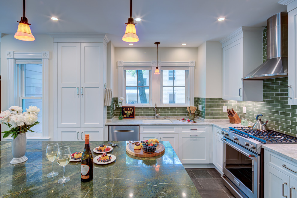Large transitional u-shaped open plan kitchen in DC Metro with an undermount sink, shaker cabinets, white cabinets, marble benchtops, green splashback, subway tile splashback, stainless steel appliances, slate floors, with island, black floor and green benchtop.