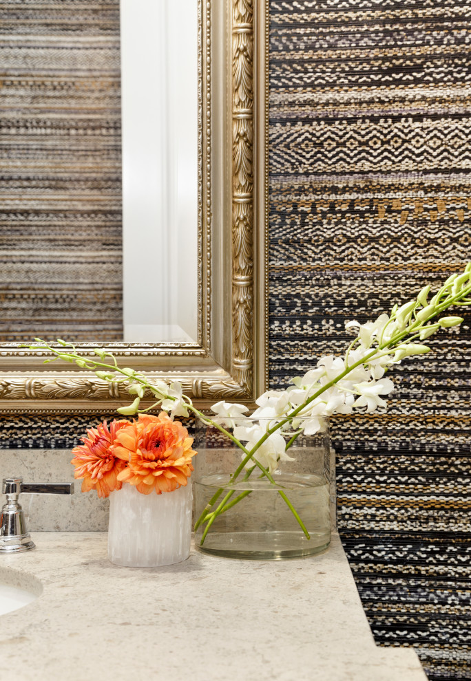 Inspiration for a large eclectic powder room in Denver with furniture-like cabinets, a built-in vanity and wallpaper.