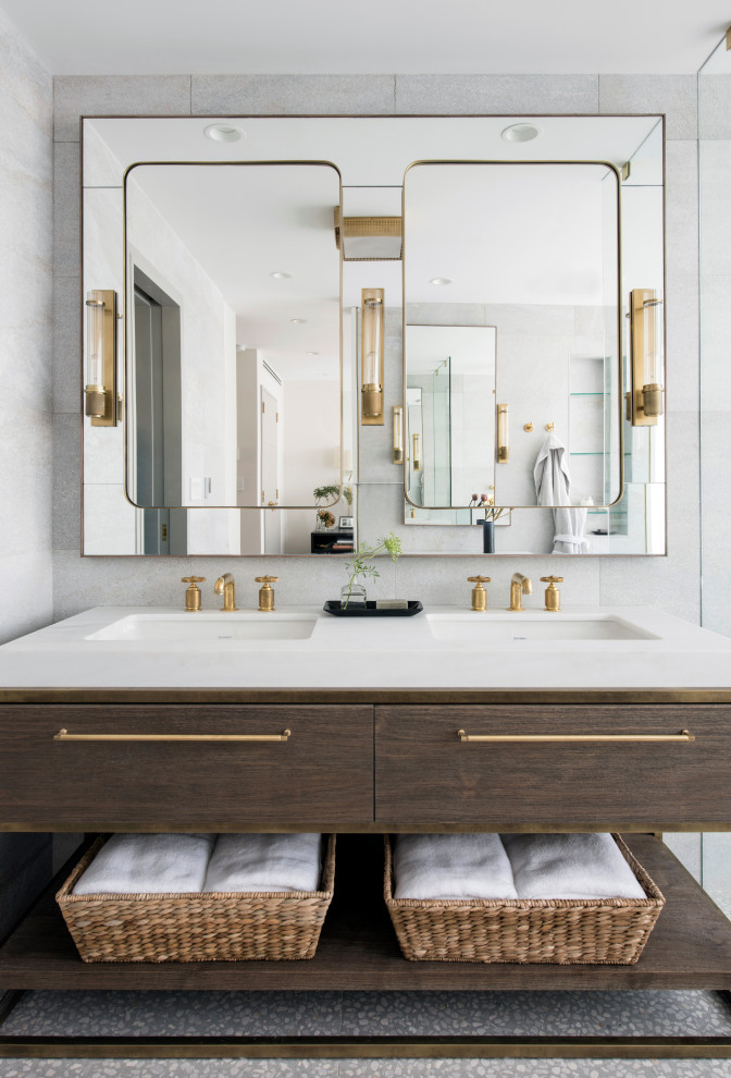 This is an example of a large contemporary bathroom in New York with medium wood cabinets, white tile, terrazzo floors, an integrated sink, grey floor, white benchtops and flat-panel cabinets.