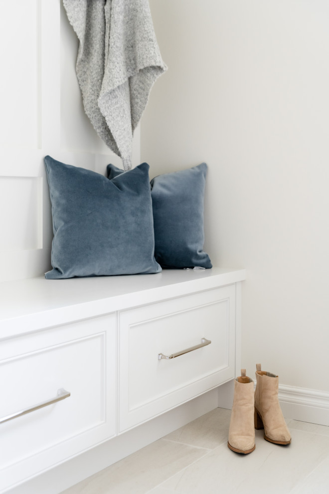 Mid-sized transitional porcelain tile and white floor mudroom photo in Vancouver with white walls and a white front door