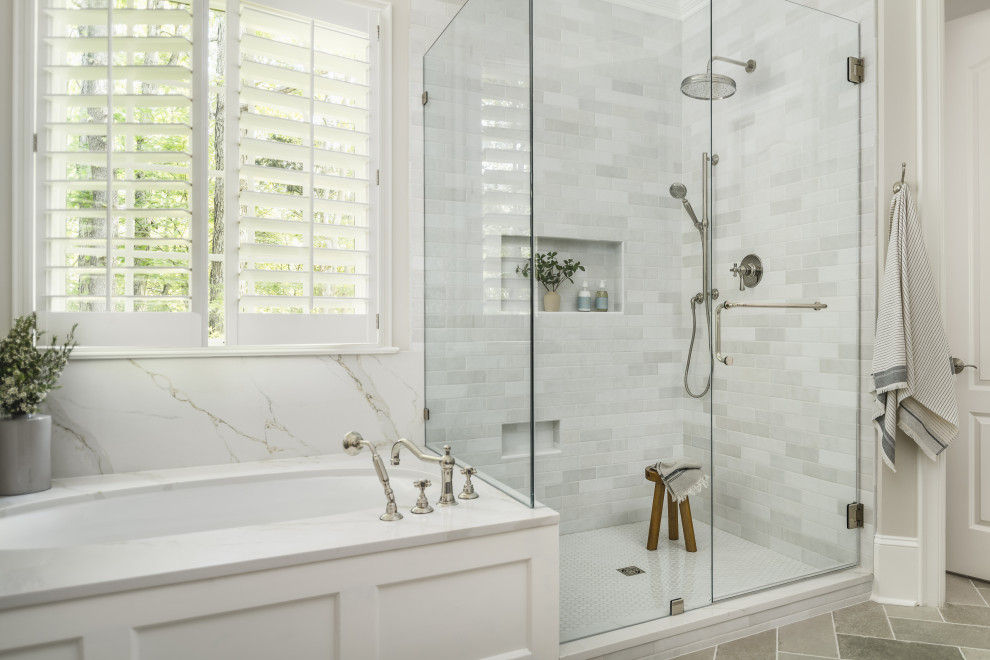 Large transitional master ceramic tile, gray floor, double-sink and coffered ceiling bathroom photo in Charlotte with shaker cabinets, blue cabinets, an undermount tub, beige walls, an undermount sink, quartz countertops, a hinged shower door, white countertops and a built-in vanity