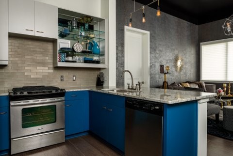 Large transitional u-shaped bamboo floor eat-in kitchen photo with an undermount sink, open cabinets, blue cabinets, granite countertops, gray backsplash, glass tile backsplash, stainless steel appliances and a peninsula