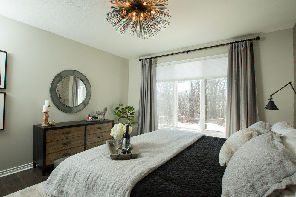 This is an example of a mid-sized eclectic master bedroom in Other with grey walls, dark hardwood floors and brown floor.