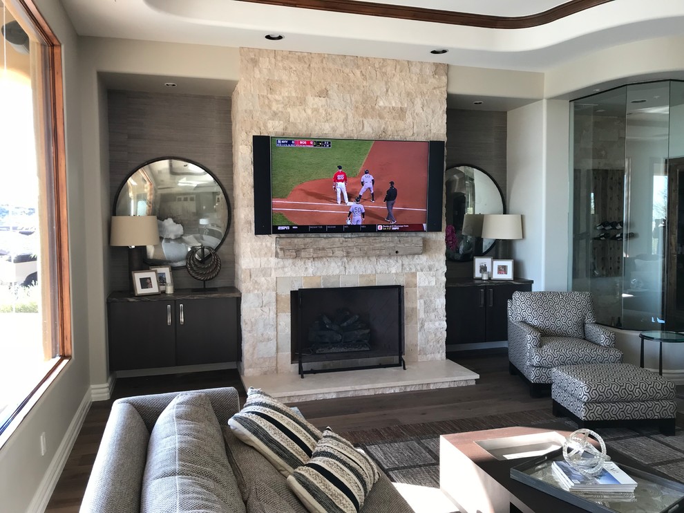 Inspiration for a large transitional enclosed family room in Denver with a music area, white walls, dark hardwood floors, a standard fireplace, a stone fireplace surround, a wall-mounted tv and brown floor.