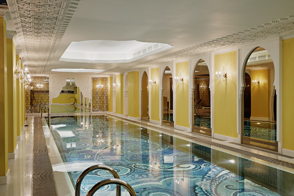 Large mediterranean indoor rectangular pool in Moscow with a pool house.