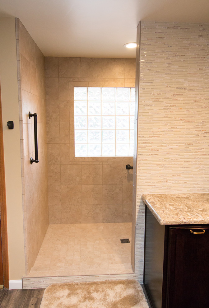 Design ideas for a mid-sized transitional master bathroom in Other with flat-panel cabinets, dark wood cabinets, an open shower, a two-piece toilet, beige tile, porcelain tile, beige walls, vinyl floors, an undermount sink and engineered quartz benchtops.