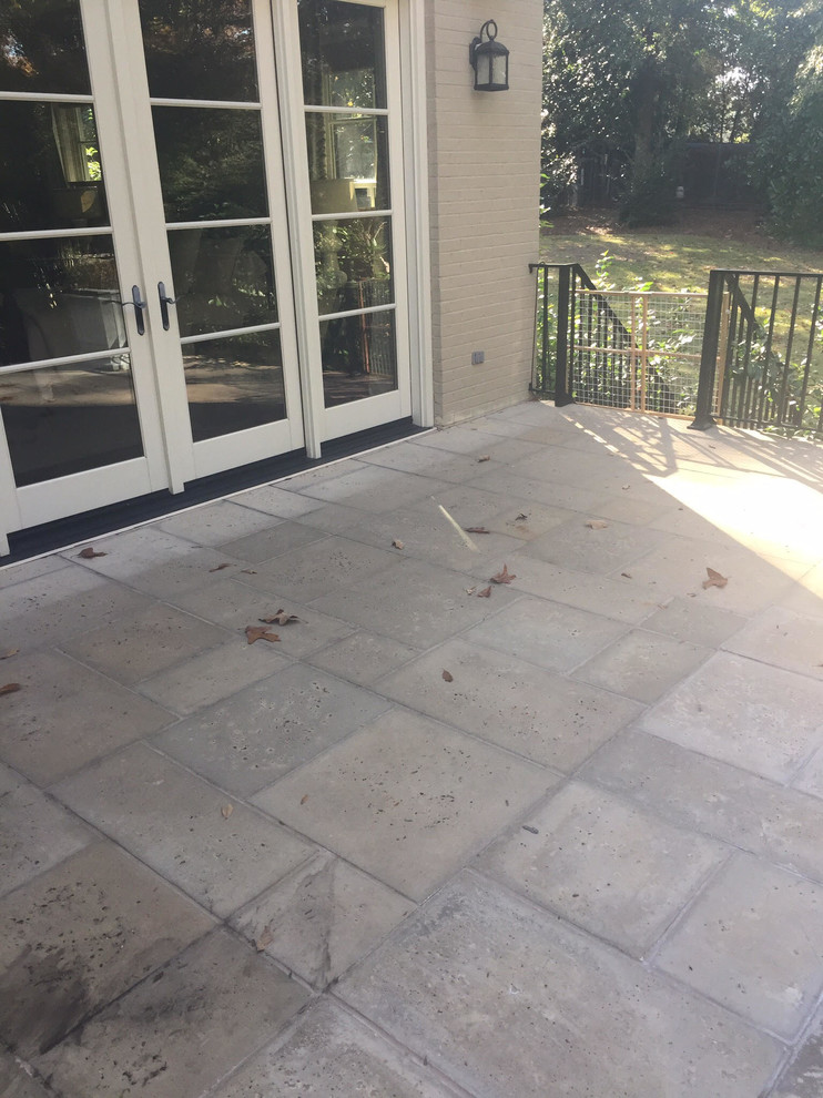 Mid-sized traditional backyard patio in Orange County with stamped concrete and no cover.
