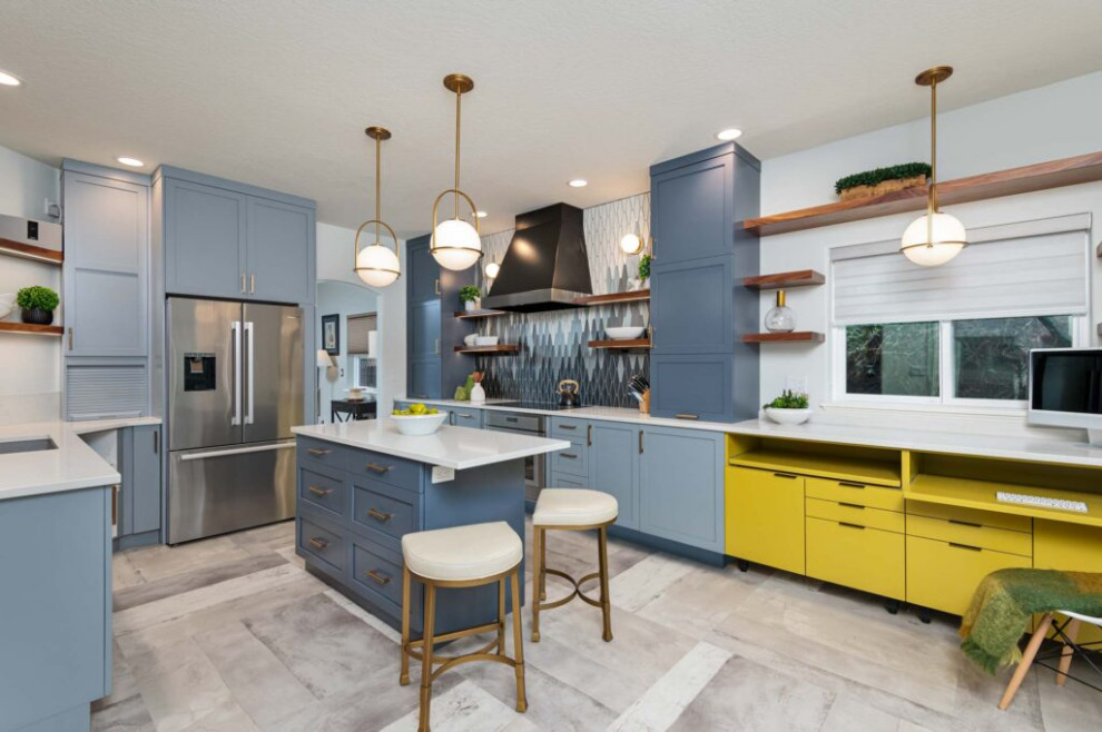 Transitional galley vinyl floor and gray floor kitchen photo with an undermount sink, shaker cabinets, blue cabinets, quartz countertops, multicolored backsplash, ceramic backsplash, stainless steel appliances, a peninsula and white countertops