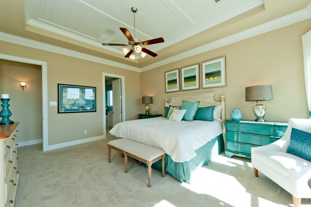This is an example of a beach style bedroom in Dallas with beige walls and carpet.