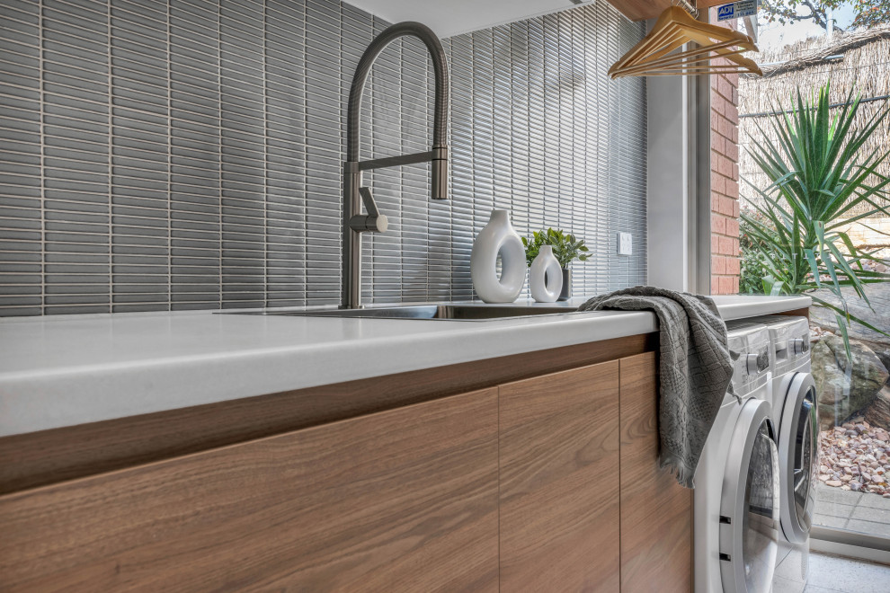 Inspiration for a contemporary laundry room in Adelaide.