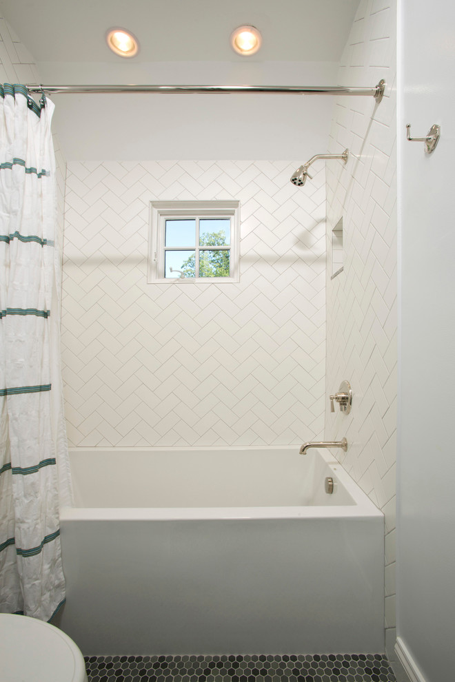 Traditional bathroom in DC Metro with an alcove tub, white tile, subway tile, white walls, mosaic tile floors and a shower/bathtub combo.