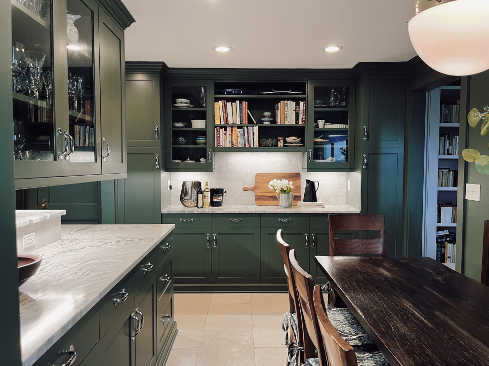 Inspiration for a mid-sized transitional l-shaped marble floor and beige floor enclosed kitchen remodel with an undermount sink, shaker cabinets, green cabinets, quartzite countertops, white backsplash, ceramic backsplash, stainless steel appliances, a peninsula and gray countertops