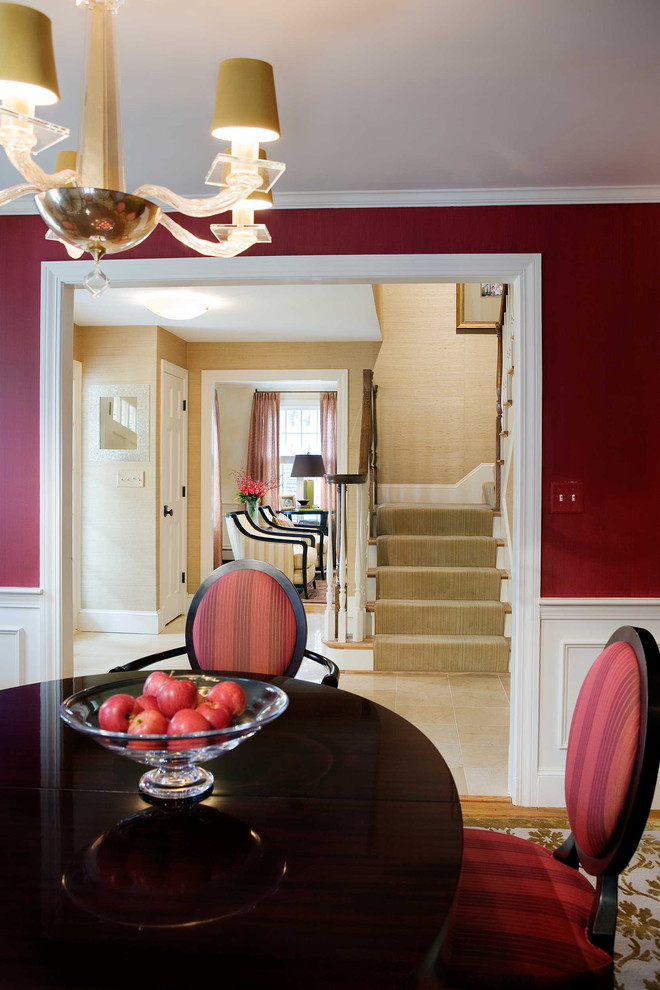 Traditional dining room in Boston with red walls.