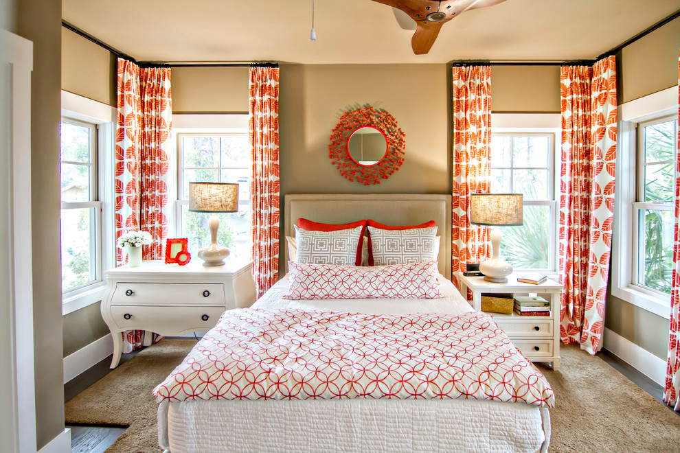 Mid-sized tropical guest bedroom in Jacksonville with beige walls, dark hardwood floors, no fireplace and brown floor.