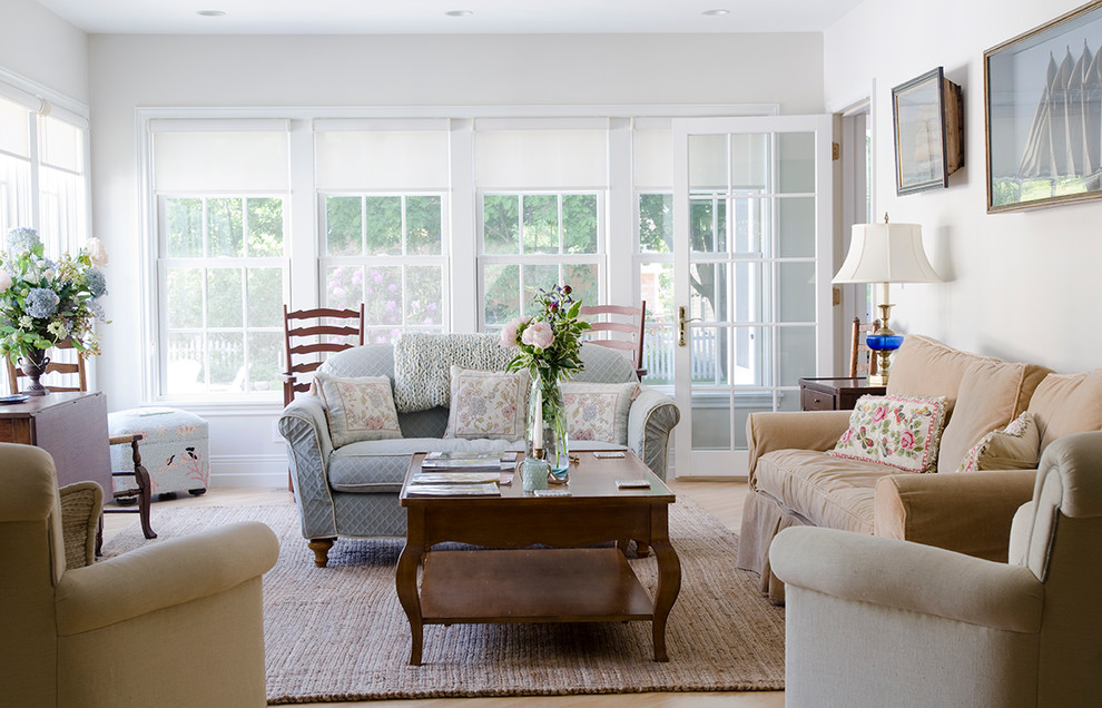 Design ideas for a traditional formal living room in Portland Maine with white walls.