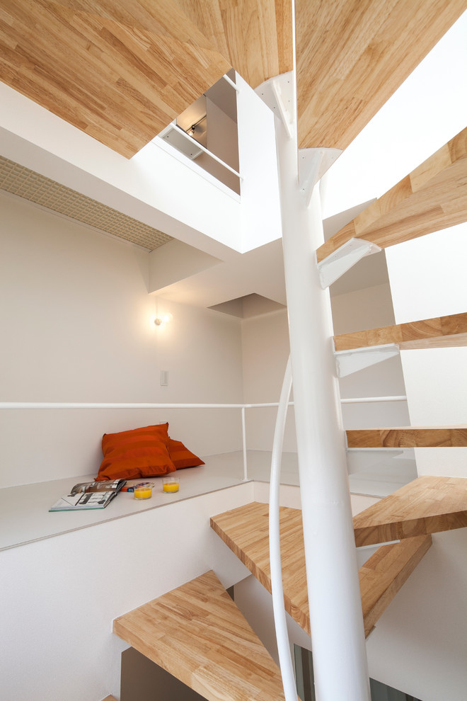 Contemporary wood staircase in Tokyo with open risers.