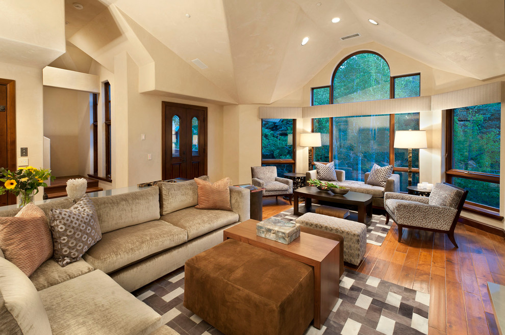 Inspiration for a large modern living room in Denver with beige walls.