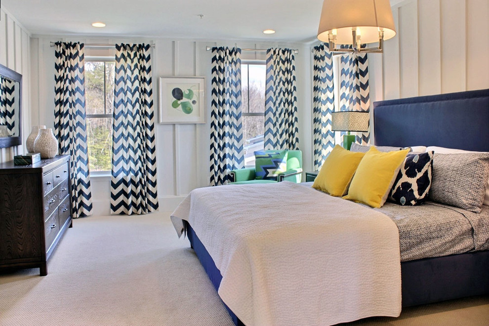 This is an example of a transitional master bedroom in DC Metro with white walls and carpet.