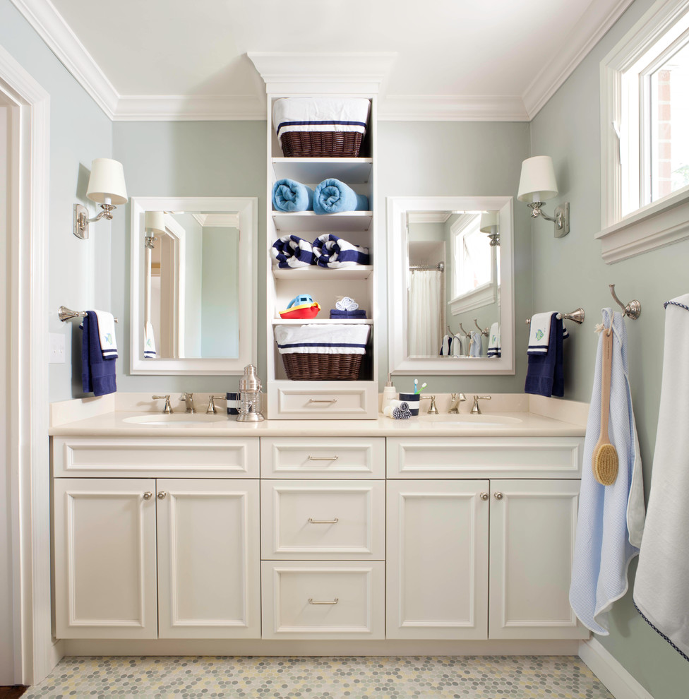 Inspiration for a mid-sized beach style kids bathroom in Denver with an undermount sink, recessed-panel cabinets, white cabinets, engineered quartz benchtops, multi-coloured tile, ceramic tile, green walls, mosaic tile floors, an alcove shower, multi-coloured floor and a shower curtain.