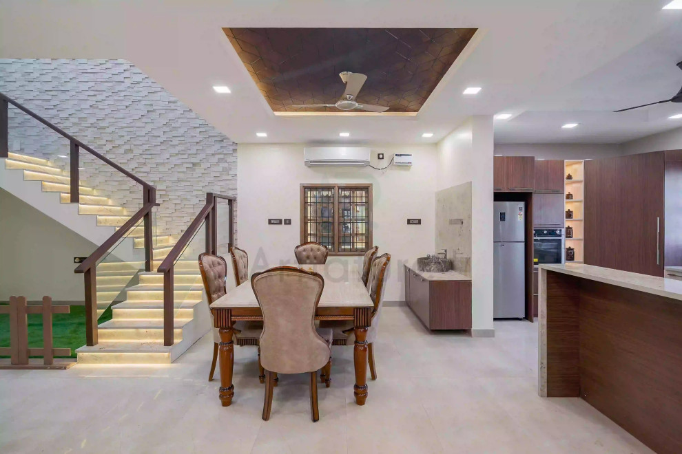 Photo of a transitional dining room in Chennai.