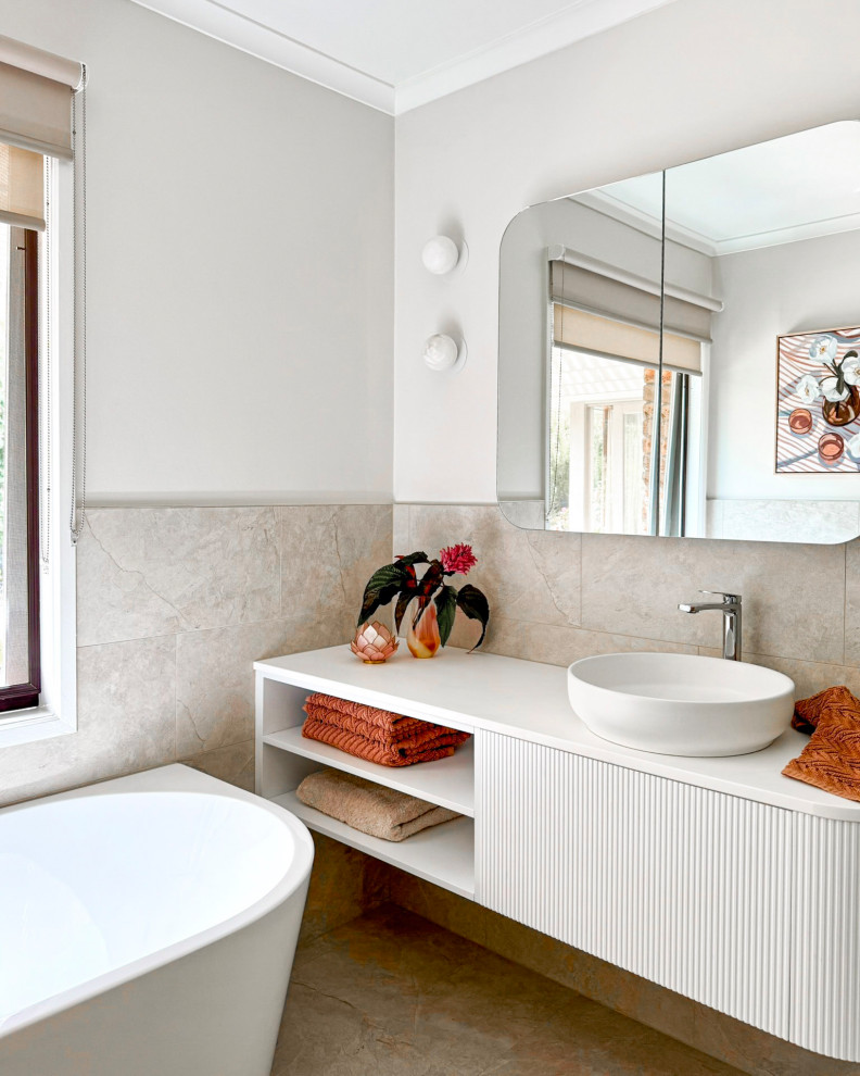 Design ideas for a small contemporary 3/4 bathroom in Melbourne with white cabinets, a corner tub, beige tile, porcelain tile, porcelain floors, engineered quartz benchtops, beige floor, white benchtops, a single vanity, a floating vanity, open cabinets, grey walls and a vessel sink.
