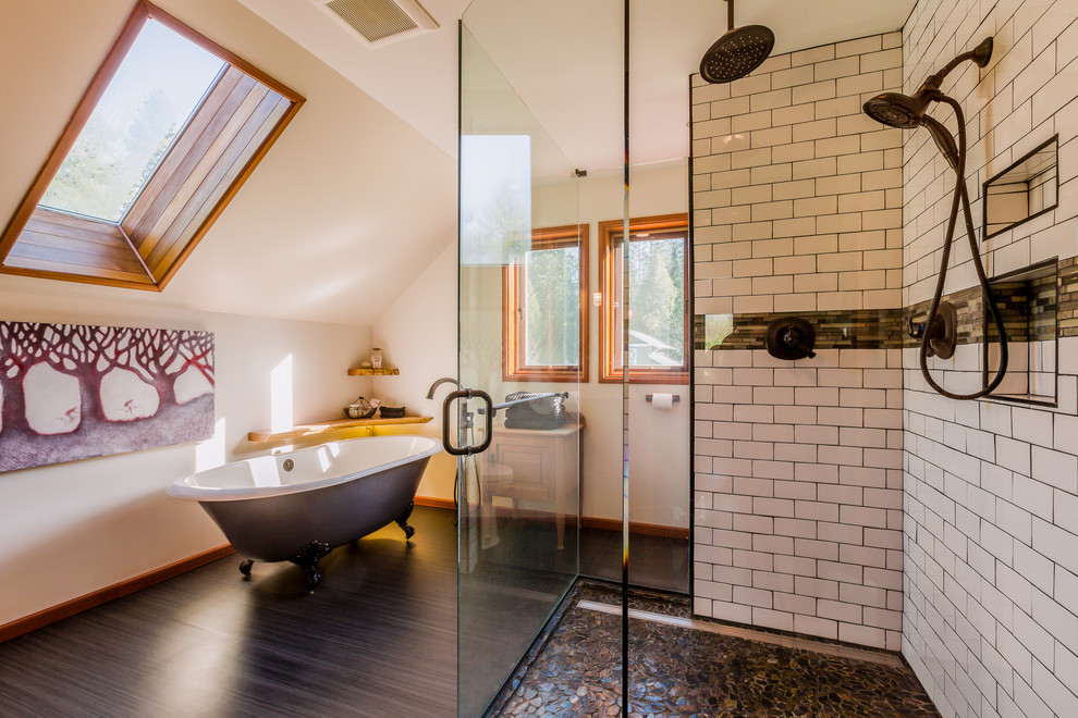 This is an example of a large country master bathroom in Vancouver with a claw-foot tub, white tile, subway tile, beige walls, dark hardwood floors, light wood cabinets, a corner shower, a two-piece toilet, an undermount sink, granite benchtops, a hinged shower door and recessed-panel cabinets.