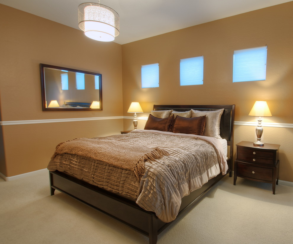 Mid-sized trendy master carpeted bedroom photo in Phoenix with beige walls