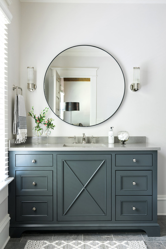 Inspiration for a beach style bathroom in Atlanta with white walls, grey floor, grey benchtops and recessed-panel cabinets.