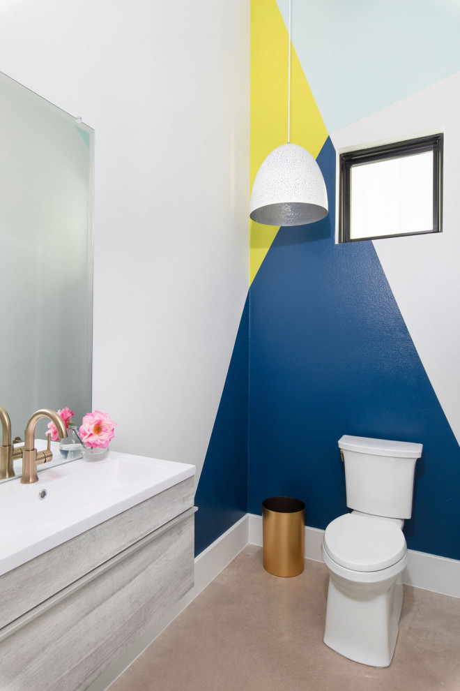 This is an example of a contemporary cloakroom in Austin with flat-panel cabinets, grey cabinets, a two-piece toilet, multi-coloured walls, concrete flooring, a console sink, grey floors, white worktops and a floating vanity unit.