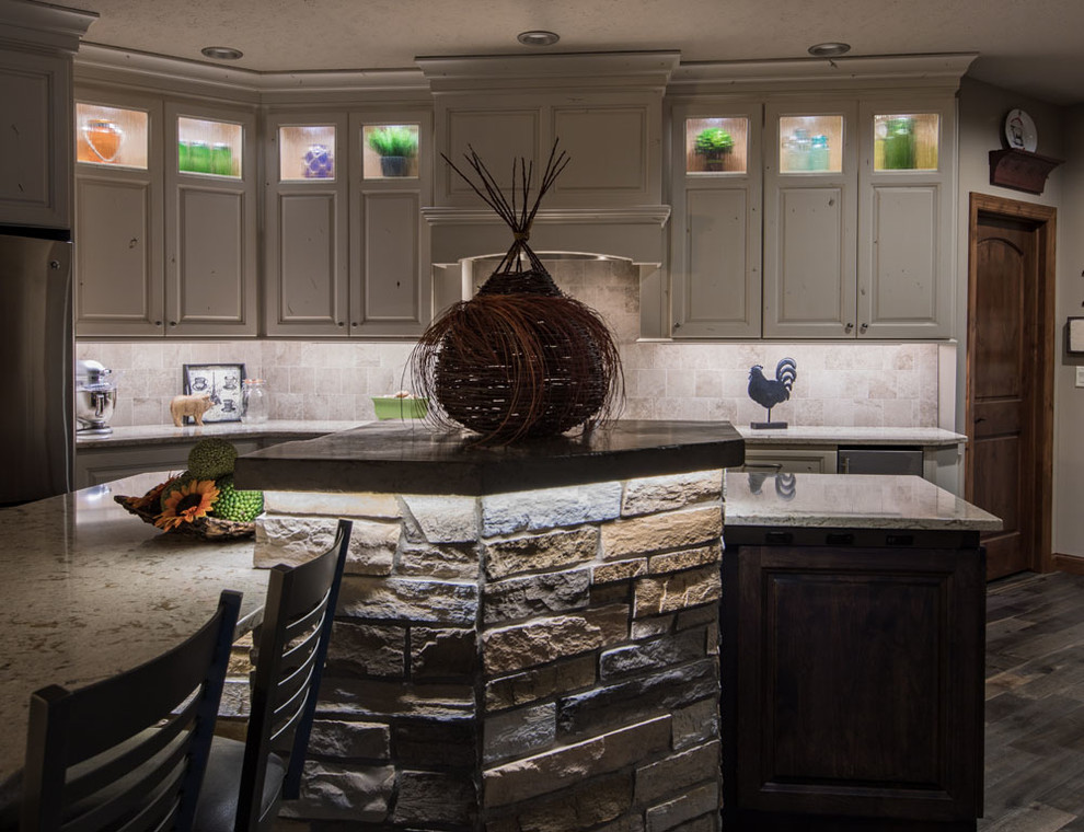Open concept kitchen - mid-sized transitional open concept kitchen idea with raised-panel cabinets, white cabinets, quartz countertops, stainless steel appliances and an island