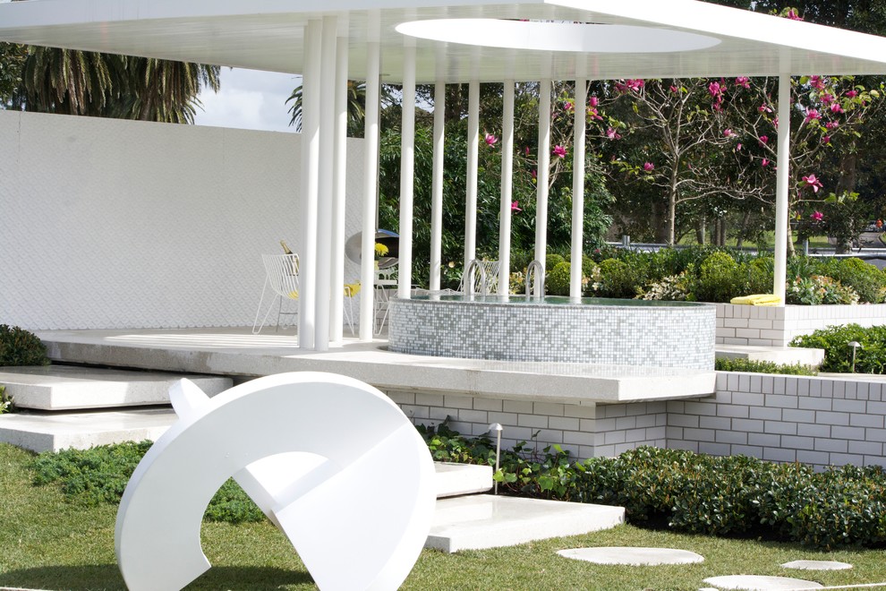 Small contemporary round aboveground pool in Sydney.